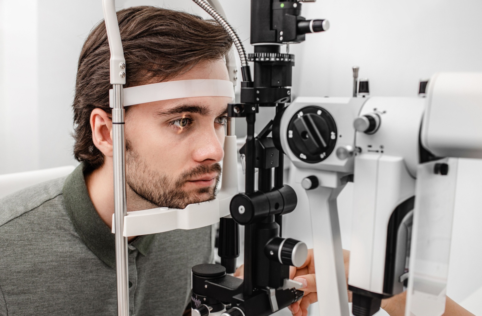 A young man undergoes an eye exam.